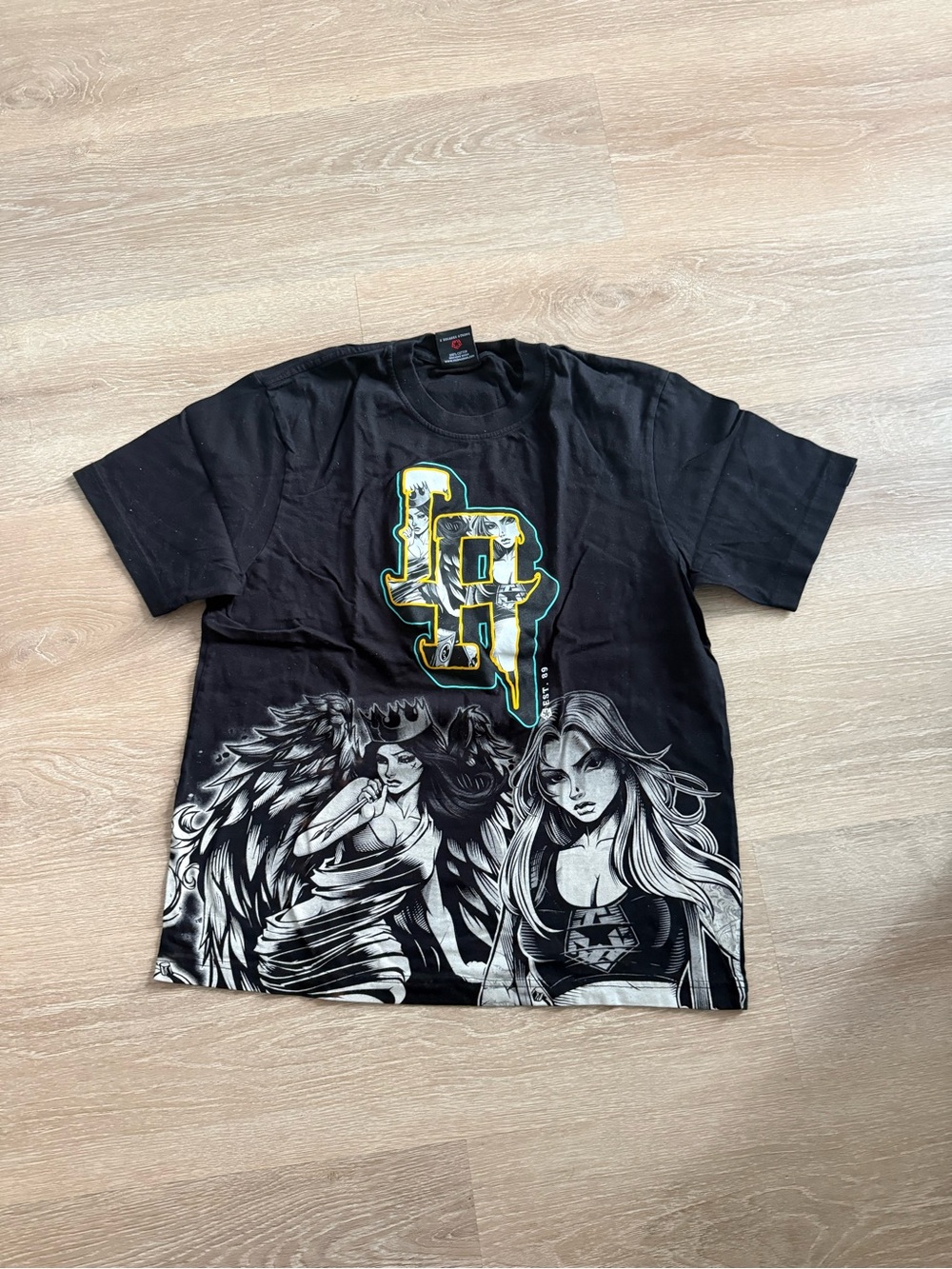 Tribal Black Graphic Tee with Yellow-Outlined Logo & Angelic Illustration